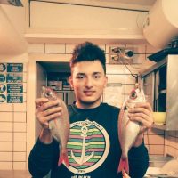 fishing-tour-amalfi-coast-chef-holding-sea-bream-kitchen